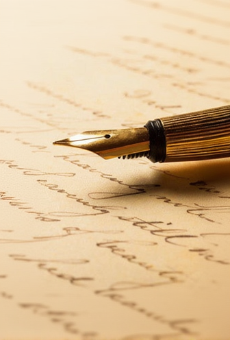 Fountain pen on an old document with cursive writing