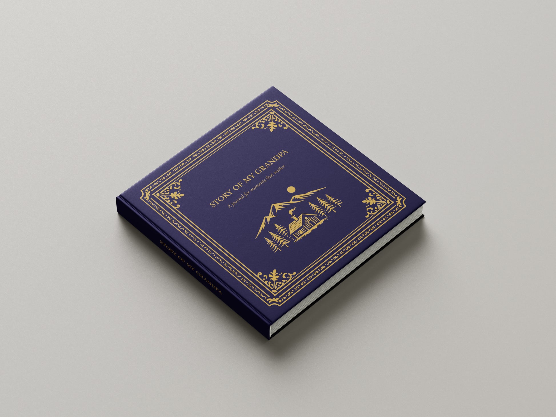 Blue book with gold embossed design on a gray background