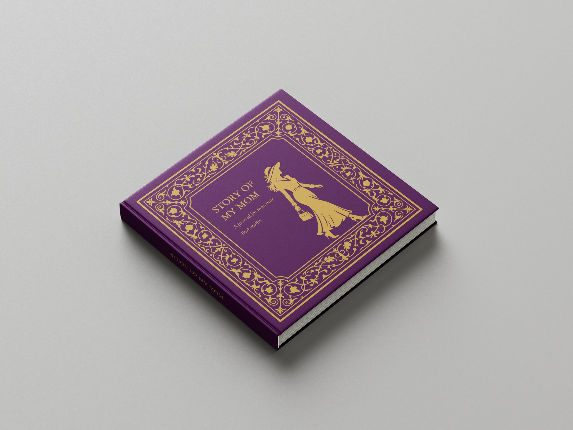 Purple book Story of My Mom with gold decorative elements on a gray background