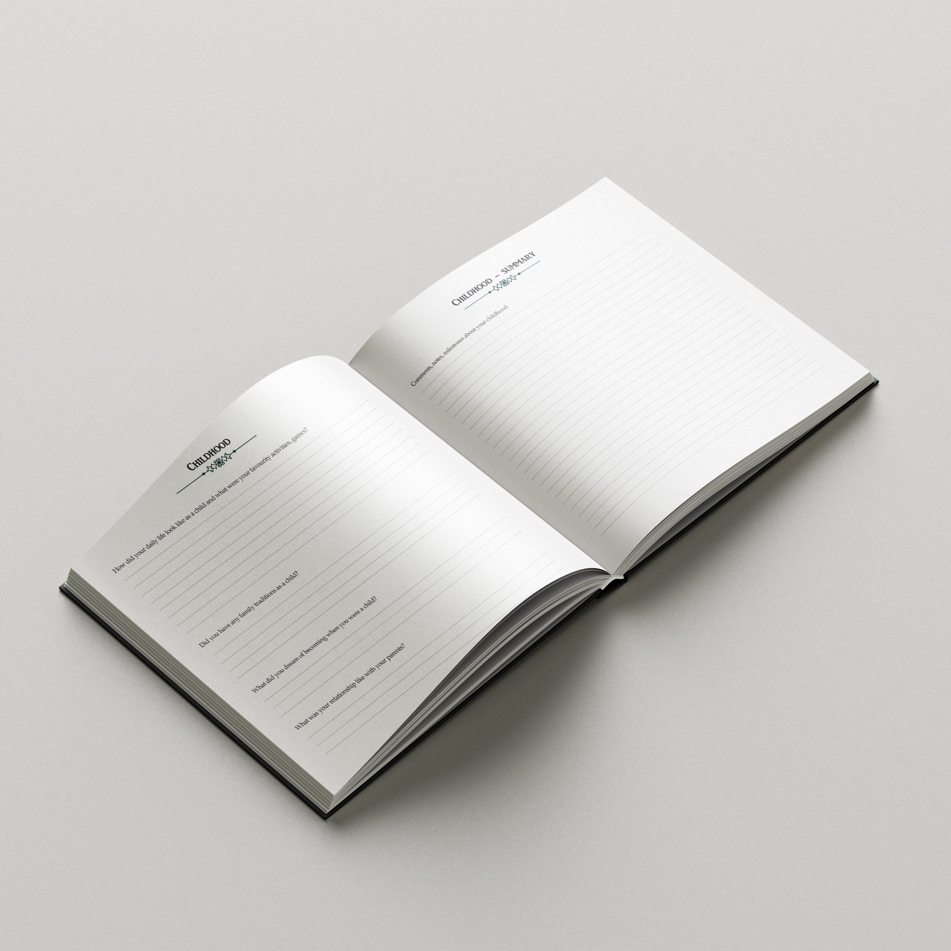 Open notebook with lined pages on a light gray background. guided memory book journal with prompts