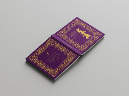 Purple book with gold decorative elements on a gray background