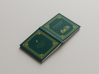 front and back cover of journal with gold embossed designs on a gray background