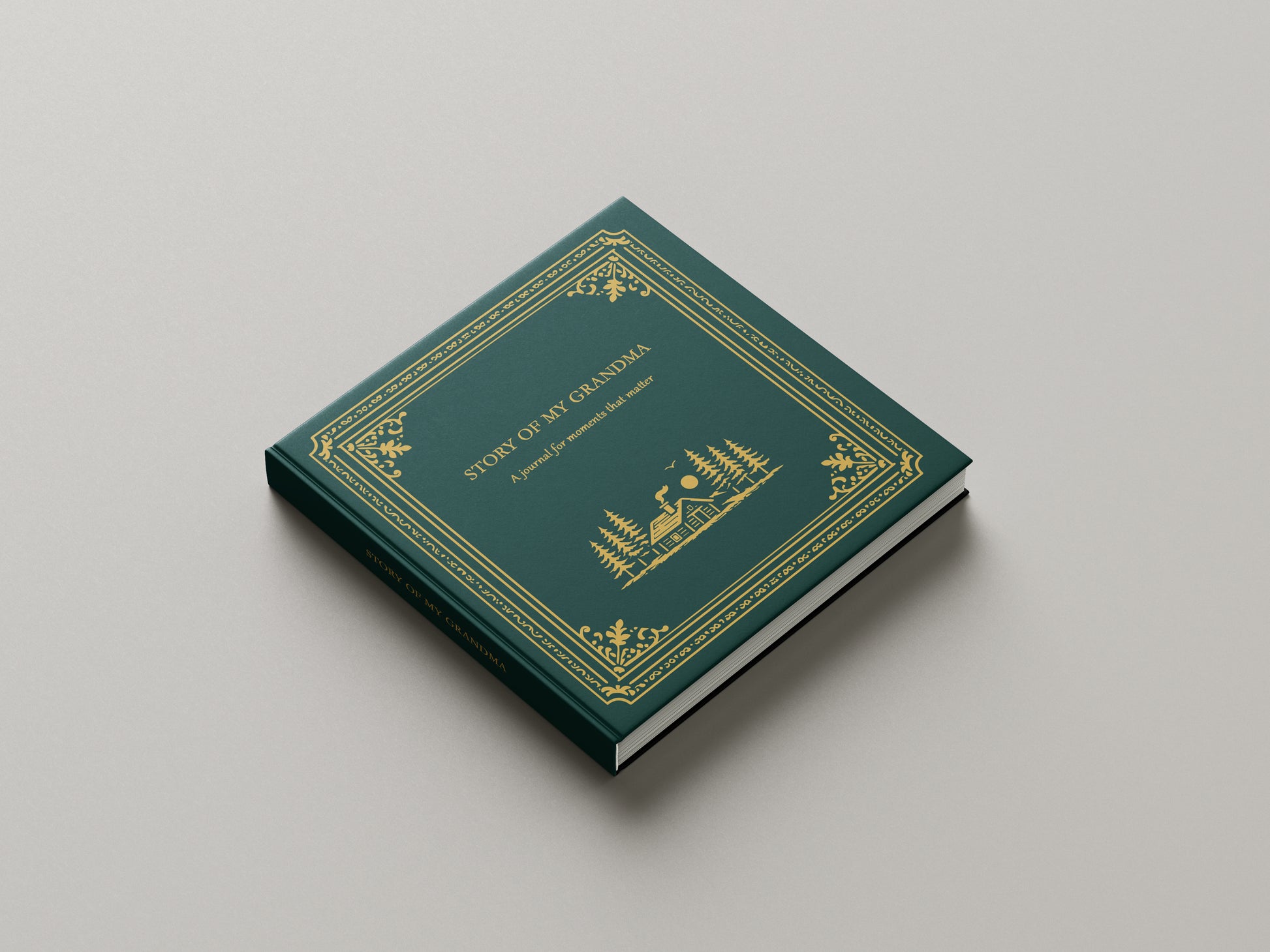 Green book with gold embossed design on a gray background
